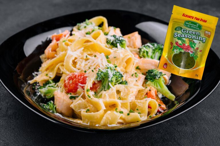 Creamy salmon and broccoli pasta with spicy green seasoning and Parmesan sauce