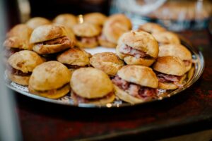 catered sliders with meat on a bun